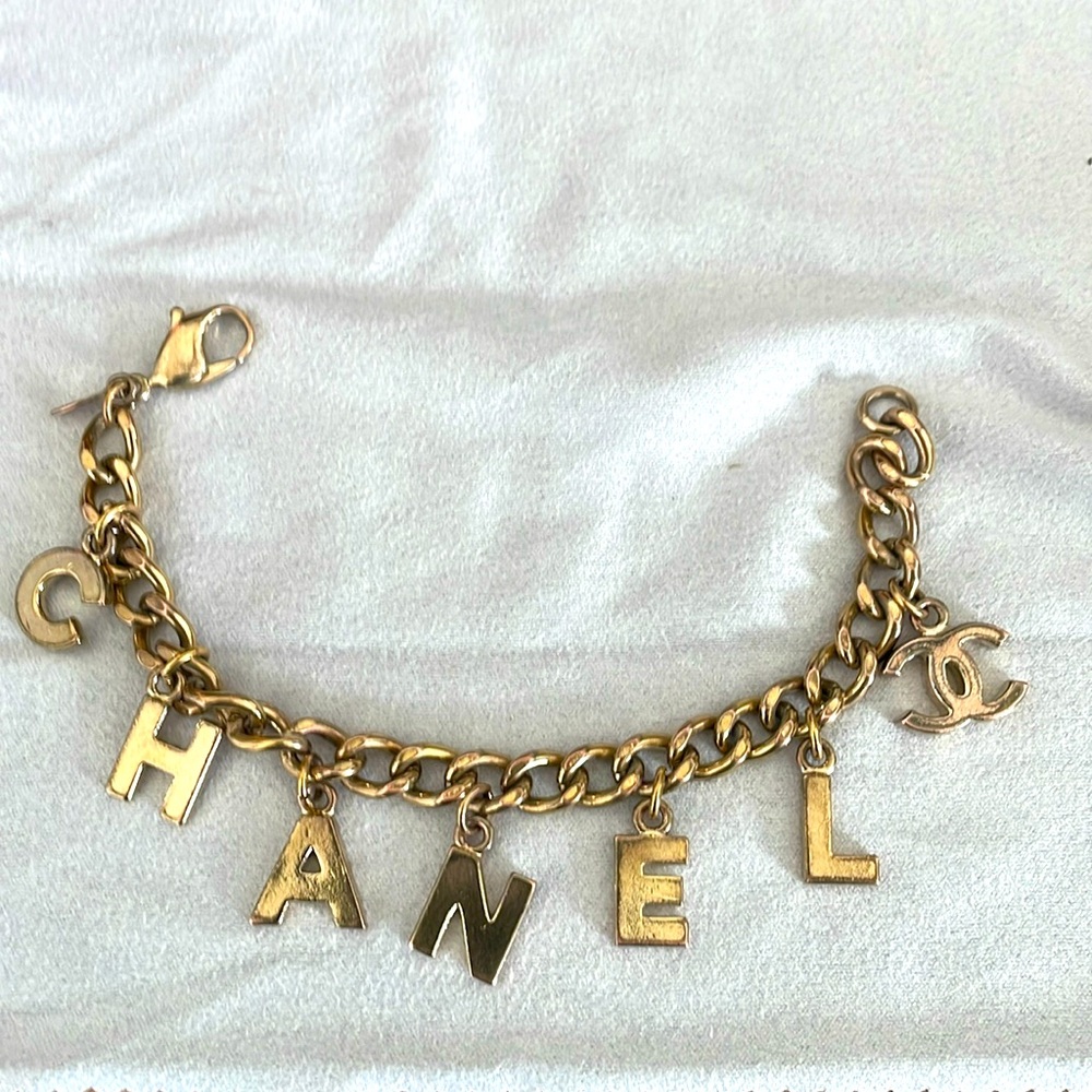 Vintage 100% Authentic Chanel charm bracelet. Original owner. Some tarnishing.